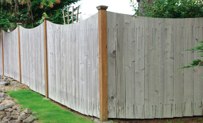 pretty fence design. sand and staining of fence to do 